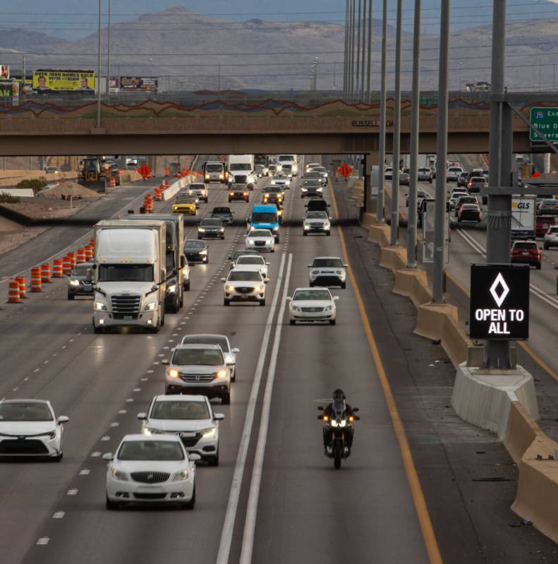 An HOV lane sign denotes that the lane is "open to all" as part of a pilot transporta ...