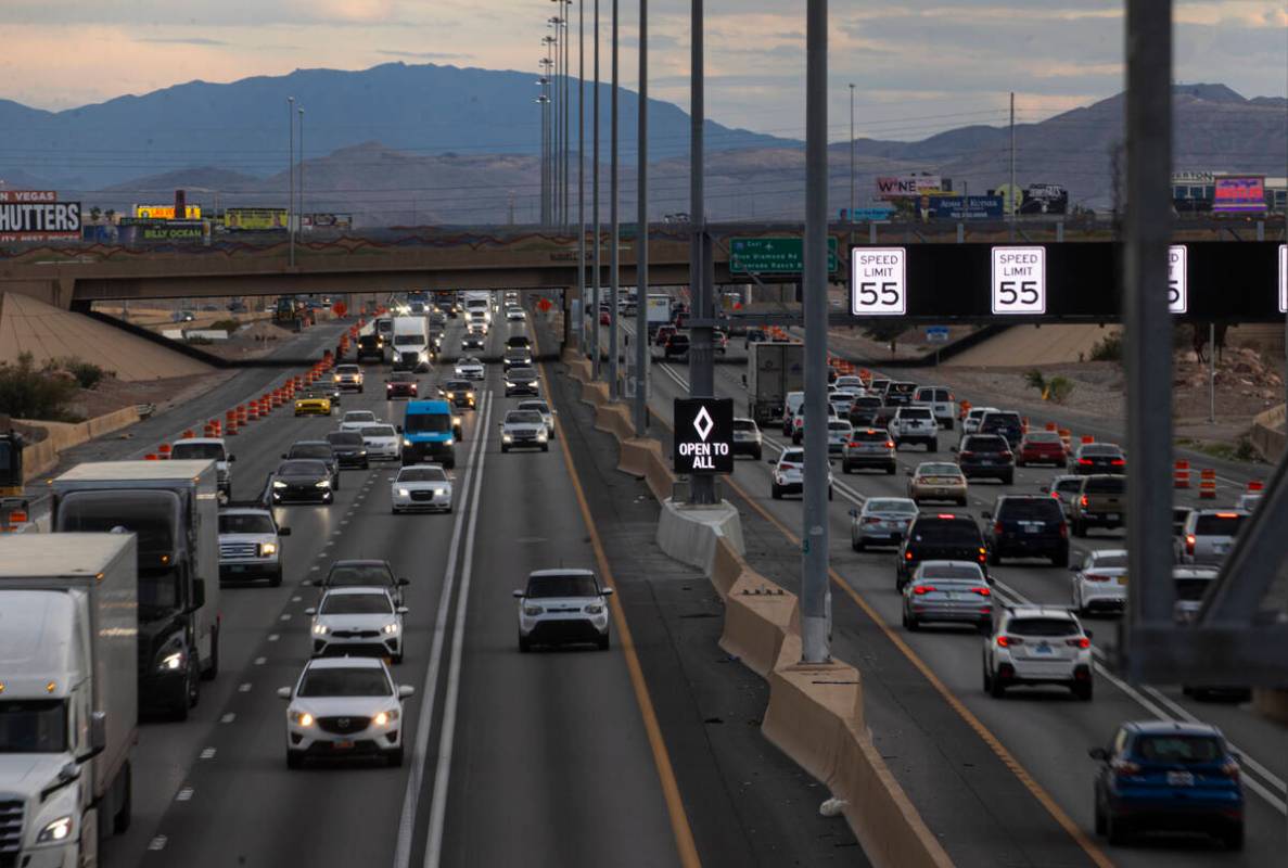 An HOV lane sign denotes that the lane is "open to all" as part of a pilot transporta ...