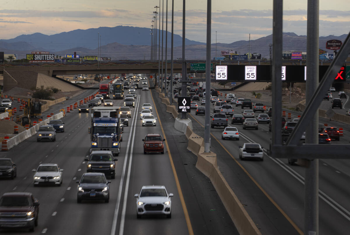 An HOV lane sign denotes that the lane is "open to all" as part of a pilot transporta ...