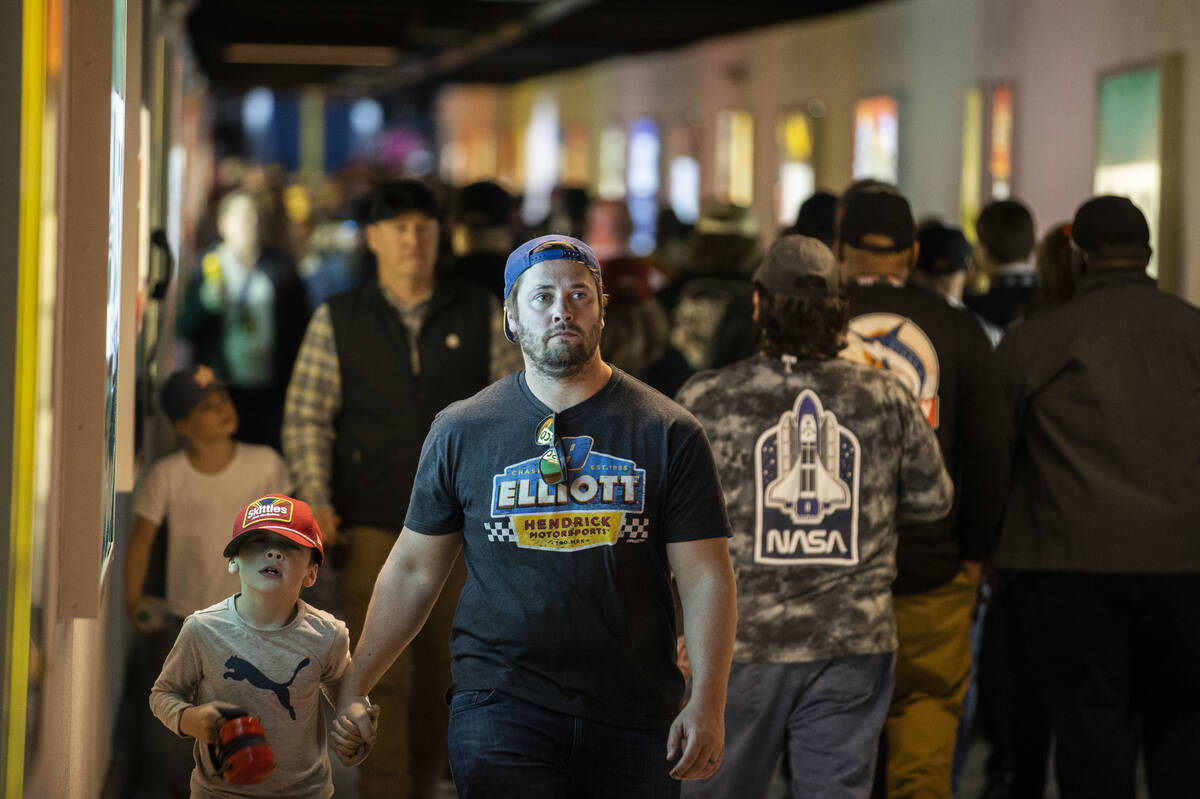 Fans make their way to the Neon Garage during the Pennzoil 400 NASCAR Cup Series race on Sunday ...