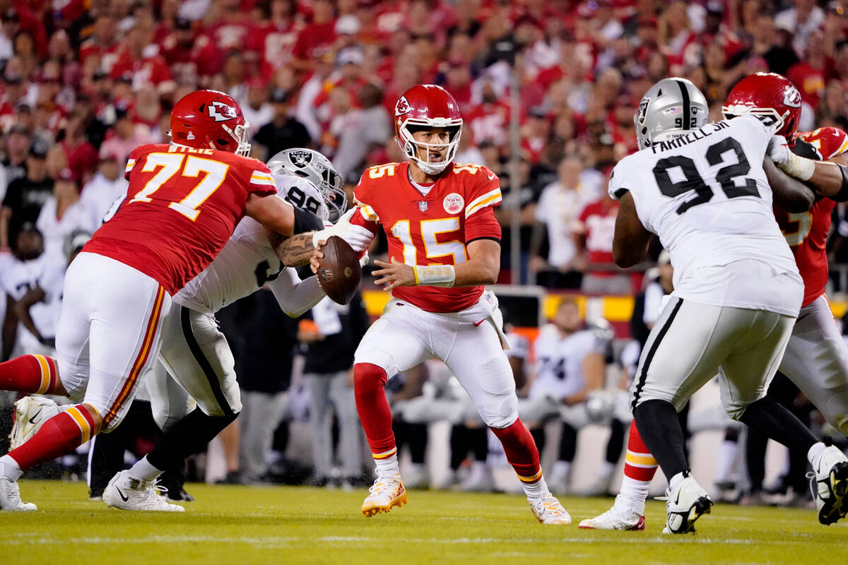 Kansas City Chiefs quarterback Patrick Mahomes scrambles during the first half of an NFL footba ...