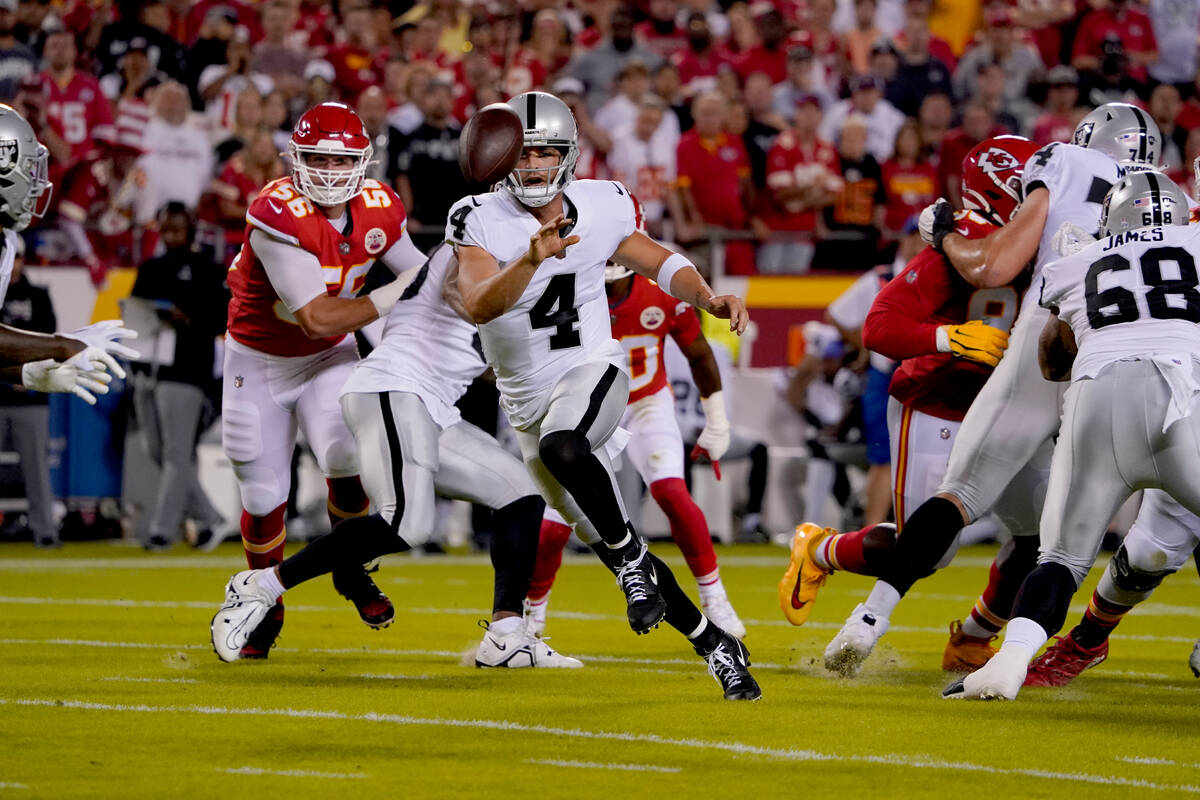 Las Vegas Raiders quarterback Derek Carr laterals during the first half of an NFL football game ...