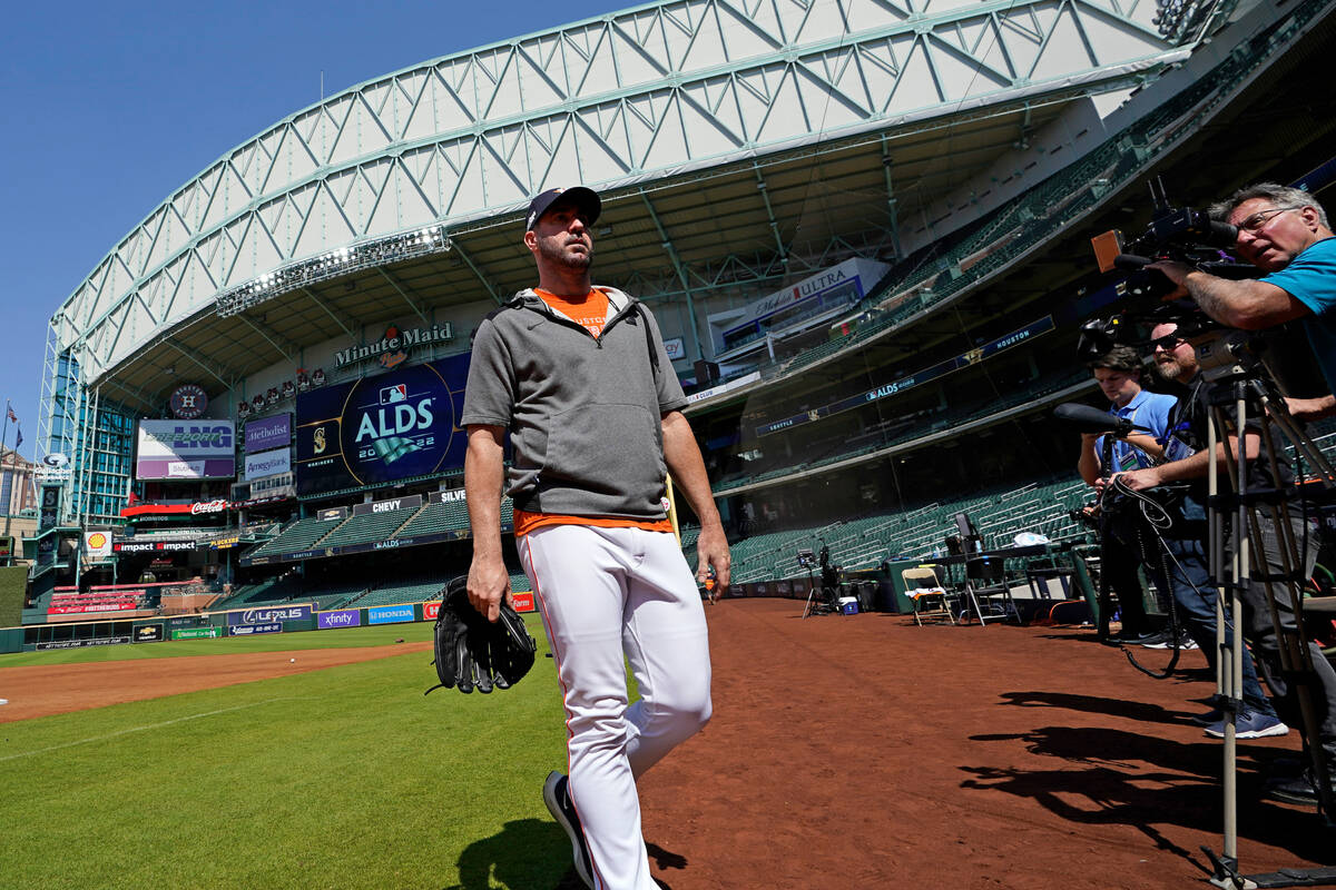 Houston Astros starting pitcher Justin Verlander walks toward the dugout after a workout ahead ...