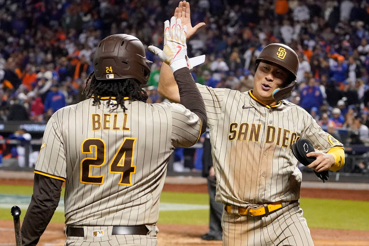 San Diego Padres shortstop Ha-Seong Kim, right, celebrates with first baseman Josh Bell (24) af ...