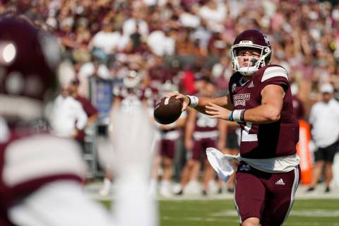 Mississippi State quarterback Will Rogers (2) passes to an open receiver during the first half ...