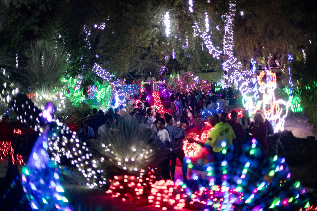 Guests walk through Ethel M Chocolates' Holiday Cactus Garden in Henderson, Nov. 5, 2019. (Rach ...