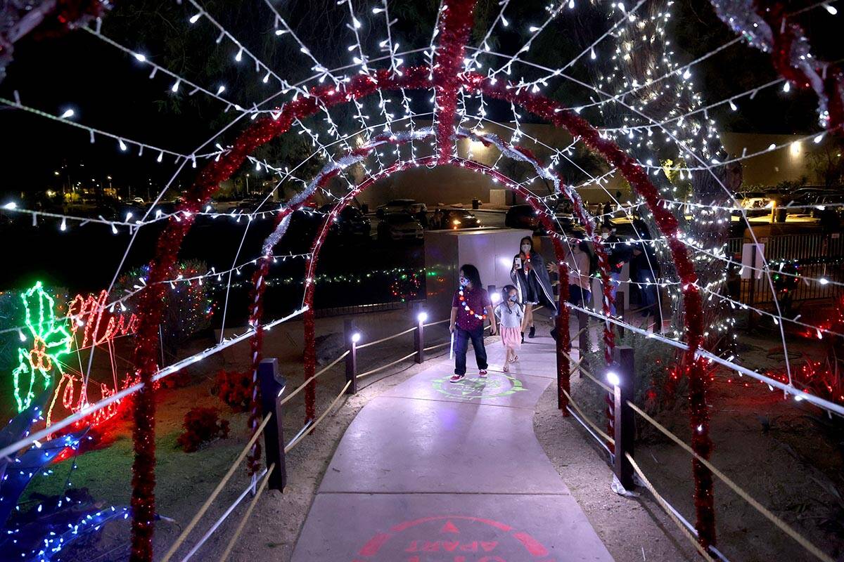 Maddox Macabenta, 7, and his sister Mila, 5, walk during the Ethel M Chocolates 27th Annual Hol ...