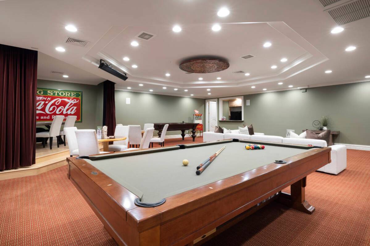 The 21,835-square-foot Tournament Hills mansion features a game room with a kitchenette that ha ...