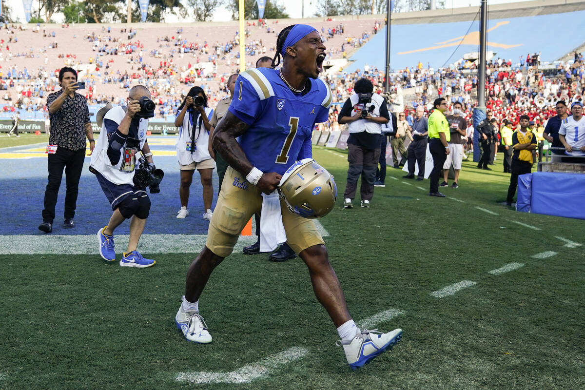 UCLA quarterback Dorian Thompson-Robinson (1) reacts after a 42-32 win over Utah in an NCAA col ...