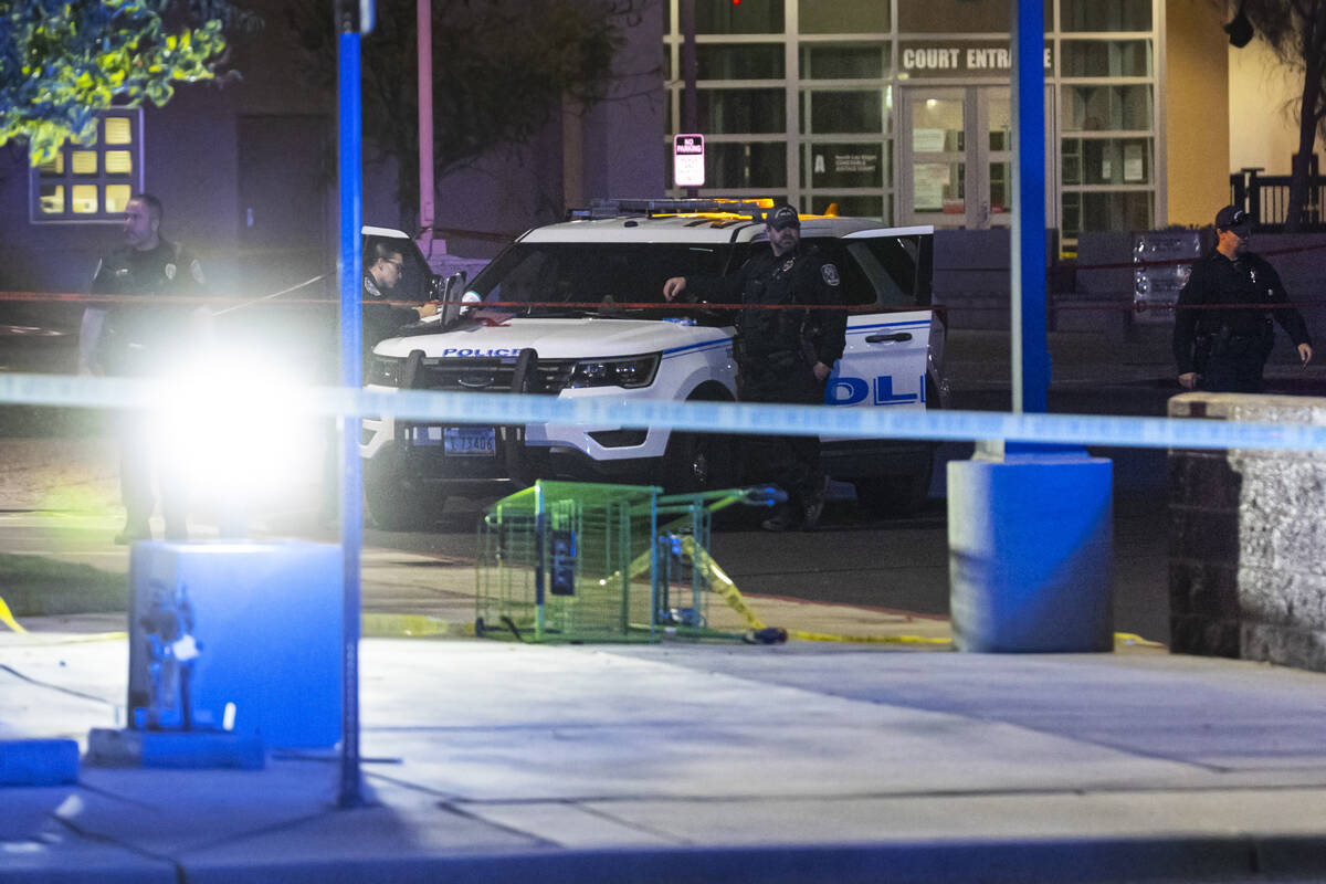 North Las Vegas police investigate the scene of an officer-involved shooting at Martin Luther K ...