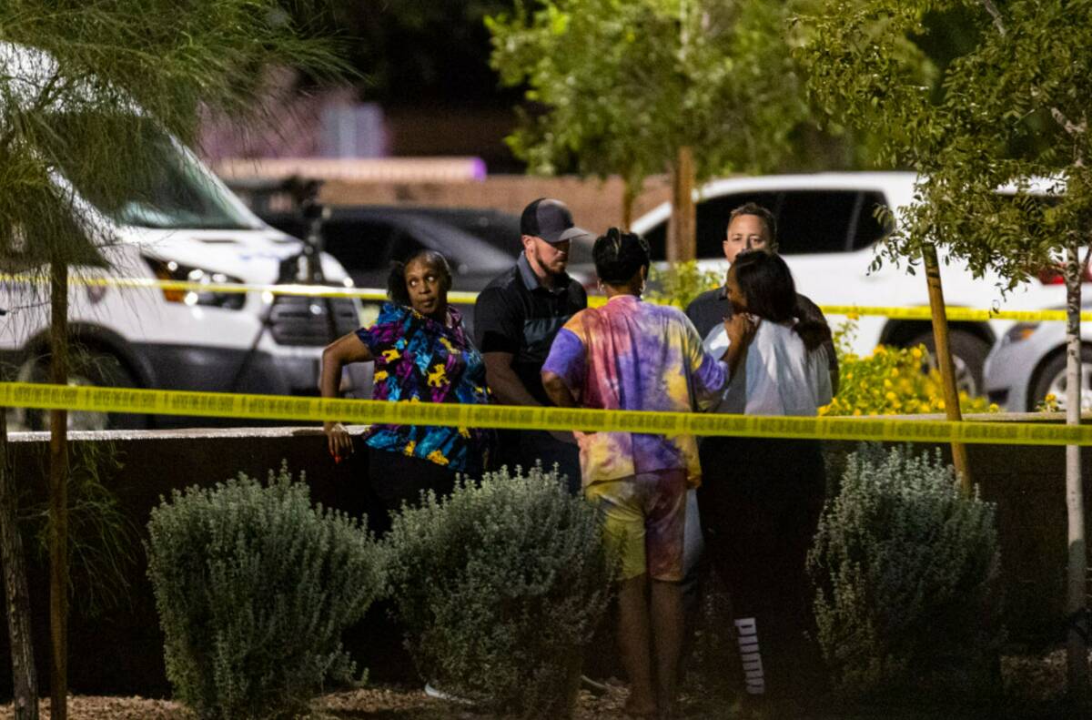 North Las Vegas police investigate the scene of an officer-involved shooting at Martin Luther K ...