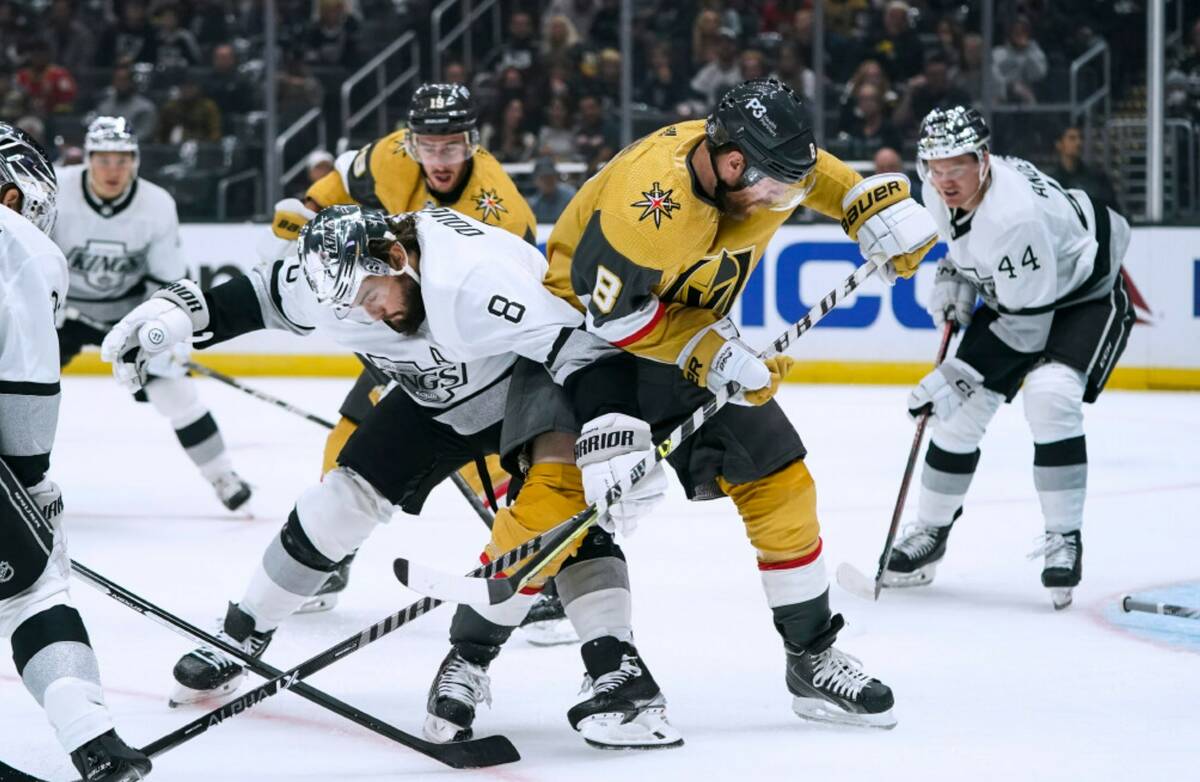 Vegas Golden Knights' Phil Kessel, right, vies for the puck against Los Angeles Kings' Drew Dou ...