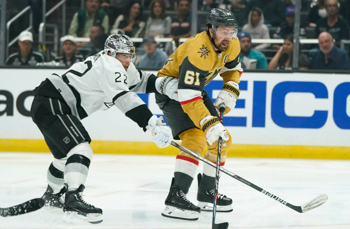 Vegas Golden Knights' Mark Stone, right, looks to shoot as he is defended by Los Angeles Kings' ...