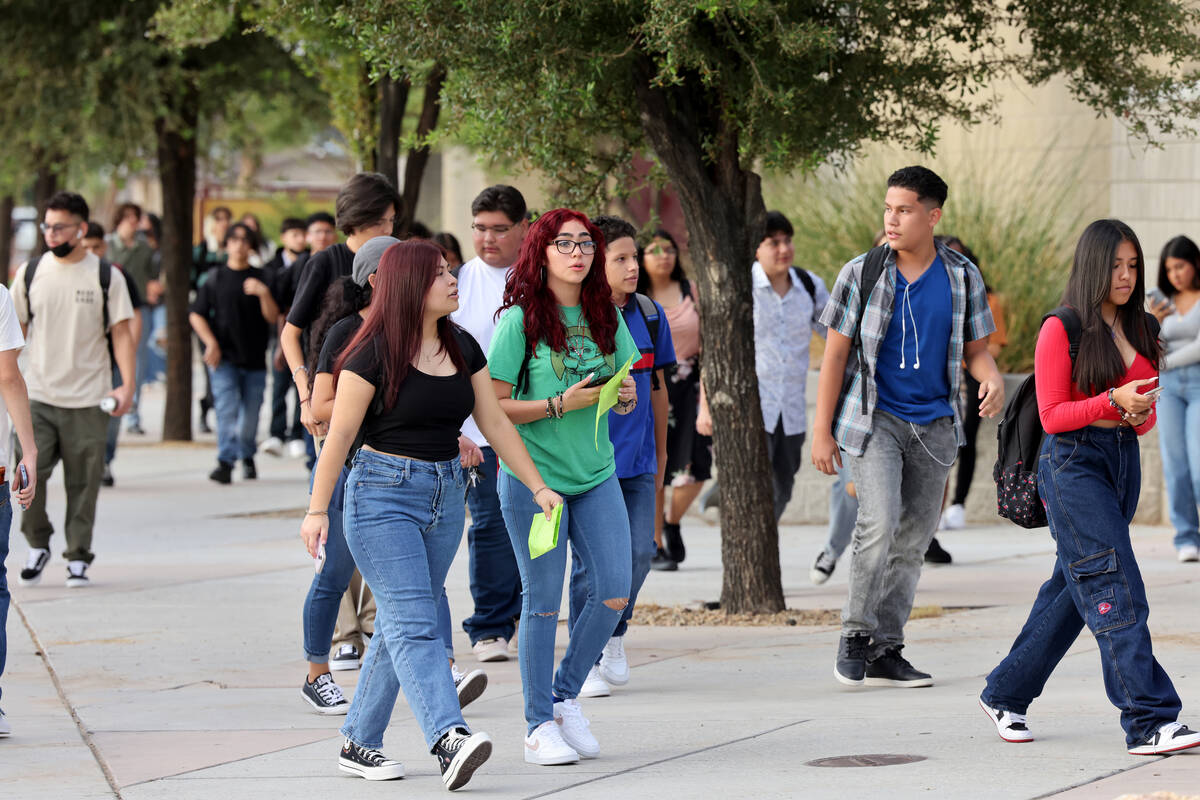 Students arrive at a single point of entry for the first day of the school year at Eldorado Hig ...