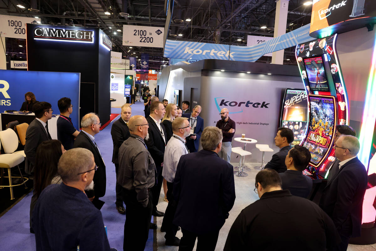 Conventioneers check out the Kortek booth at the Global Gaming Expo (G2E) at The Venetian Expo ...
