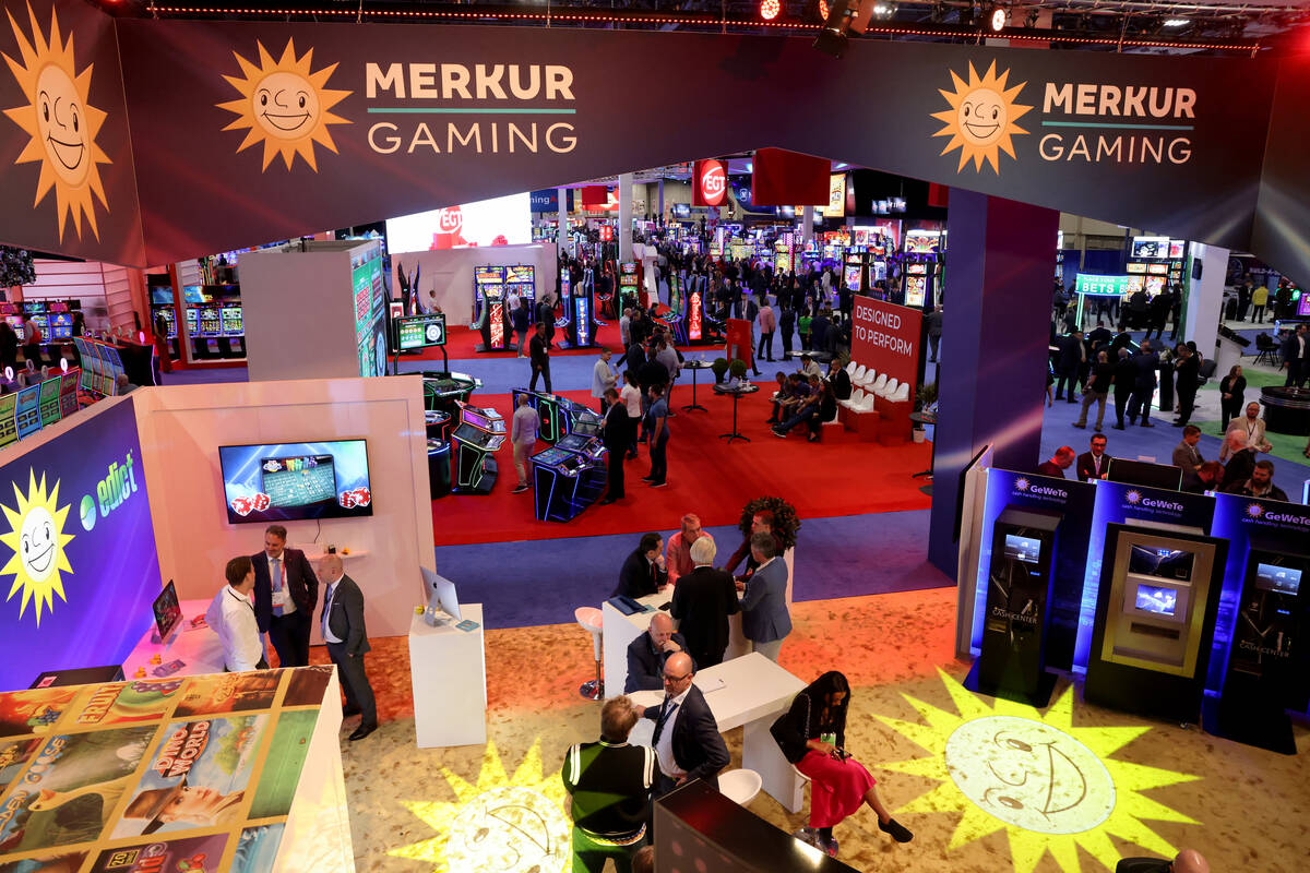 Conventioneers at the Merkur Gaming booth on the show floor at the Global Gaming Expo (G2E) at ...