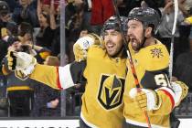 Golden Knights center Chandler Stephenson (20) celebrates with Golden Knights right wing Mark S ...