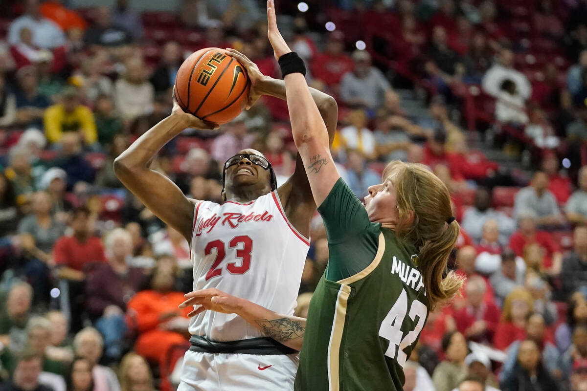 UNLV center Desi-Rae Young (23) shoots as Colorado State forward Karly Murphy (42) defends duri ...