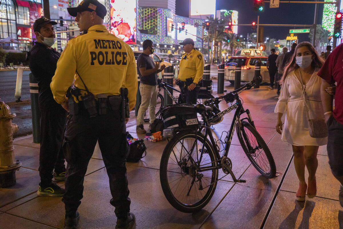 Las Vegas Metro Police are seen patrolling near the Bellagio hotel and casino fountains on the ...