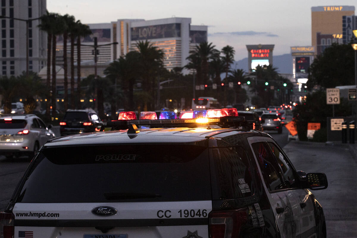 Metropolitan police patrol the Las Vegas Strip outside of Planet Hollywood on Tuesday, Aug. 2, ...