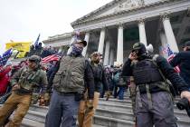 FILE - Members of the Oath Keepers on the East Front of the U.S. Capitol on Jan. 6, 2021, in Wa ...