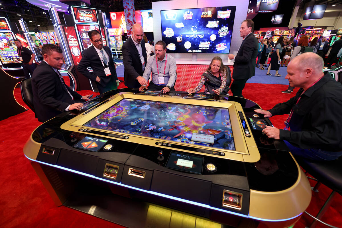 Conventioneers in the Gaming Arts booth at the Global Gaming Expo (G2E) at The Venetian Expo in ...