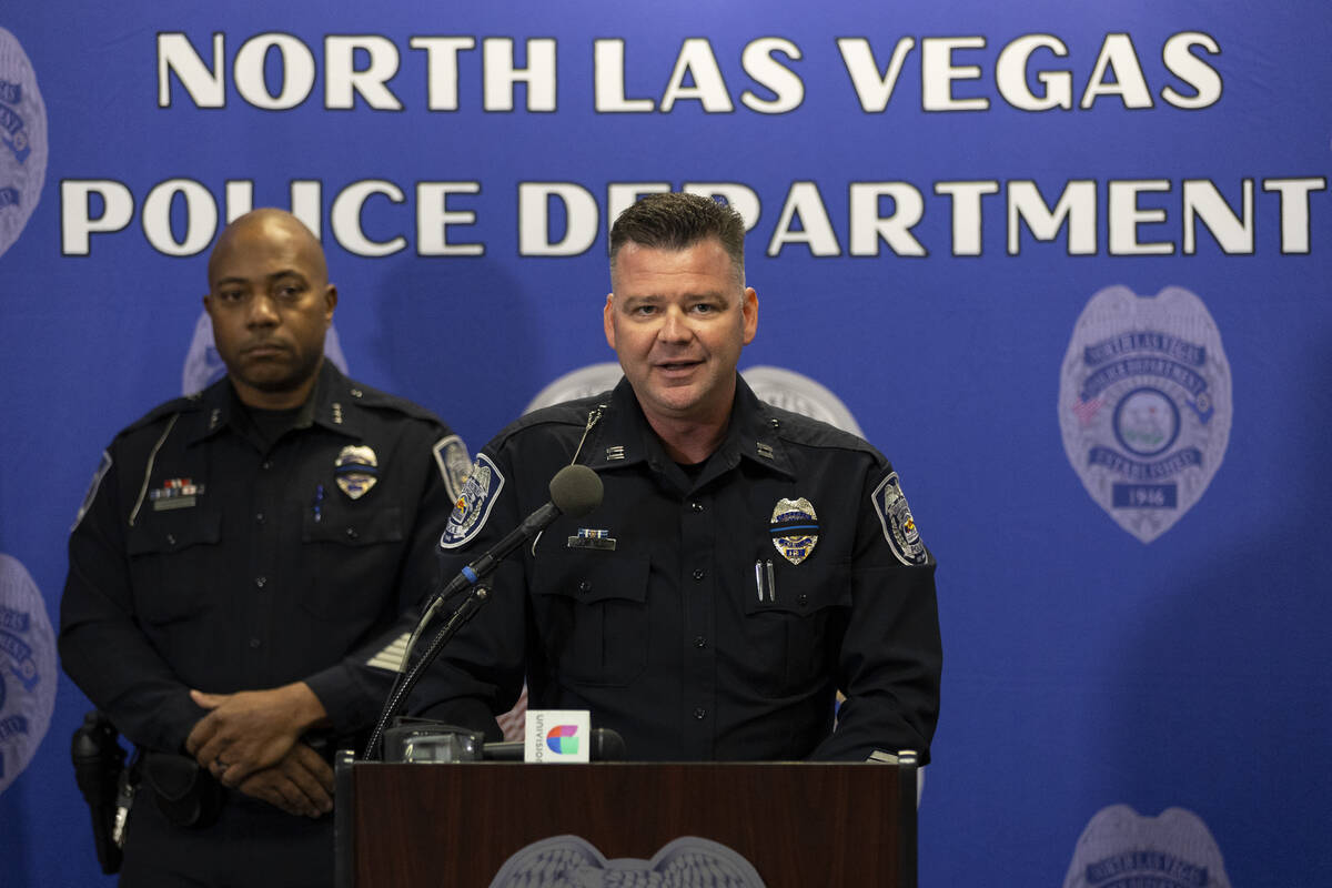 Captain Adam Hyde, right, with Assistant Chief Michael Harris, speaks on an officer involved sh ...