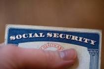 FILE - A Social Security card is displayed on Oct. 12, 2021, in Tigard, Ore. Millions of Social ...
