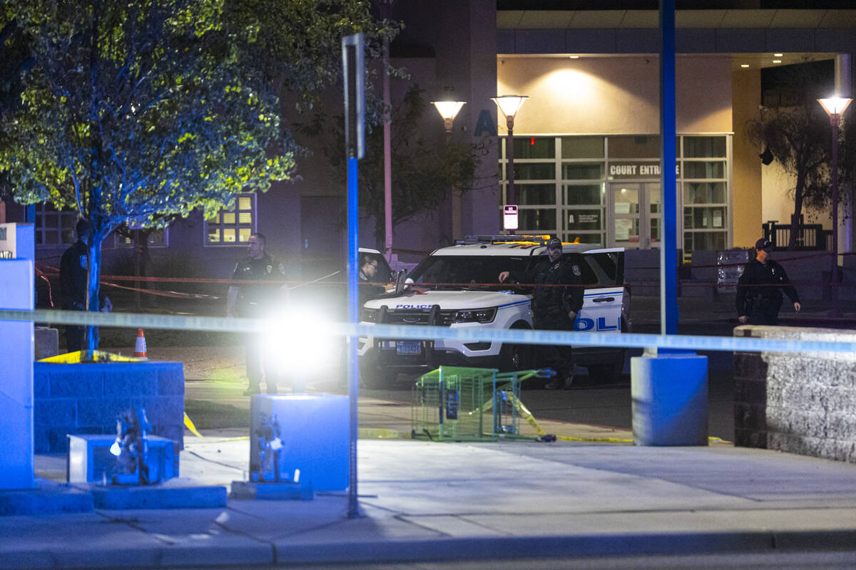 North Las Vegas police investigate the scene of an officer-involved shooting at Martin Luther K ...