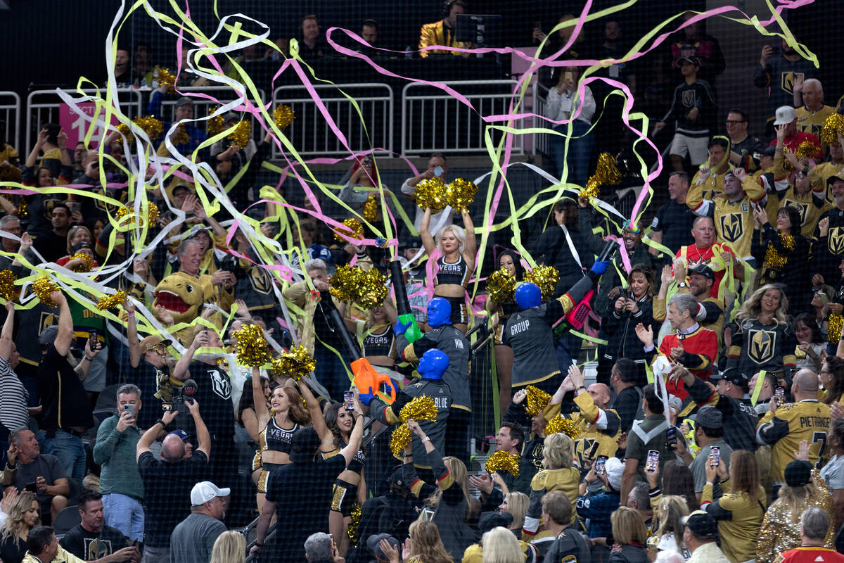 The Blue Man Group pumps up the crowd with confetti during the third period of an NHL hockey ga ...