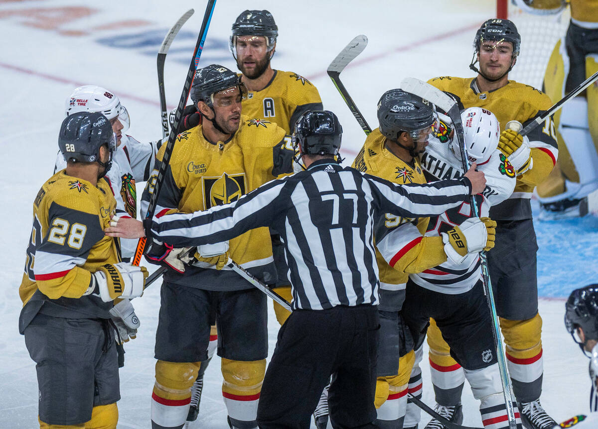 Golden Knights and Chicago Blackhawks players get into a scuffle during the third period of the ...