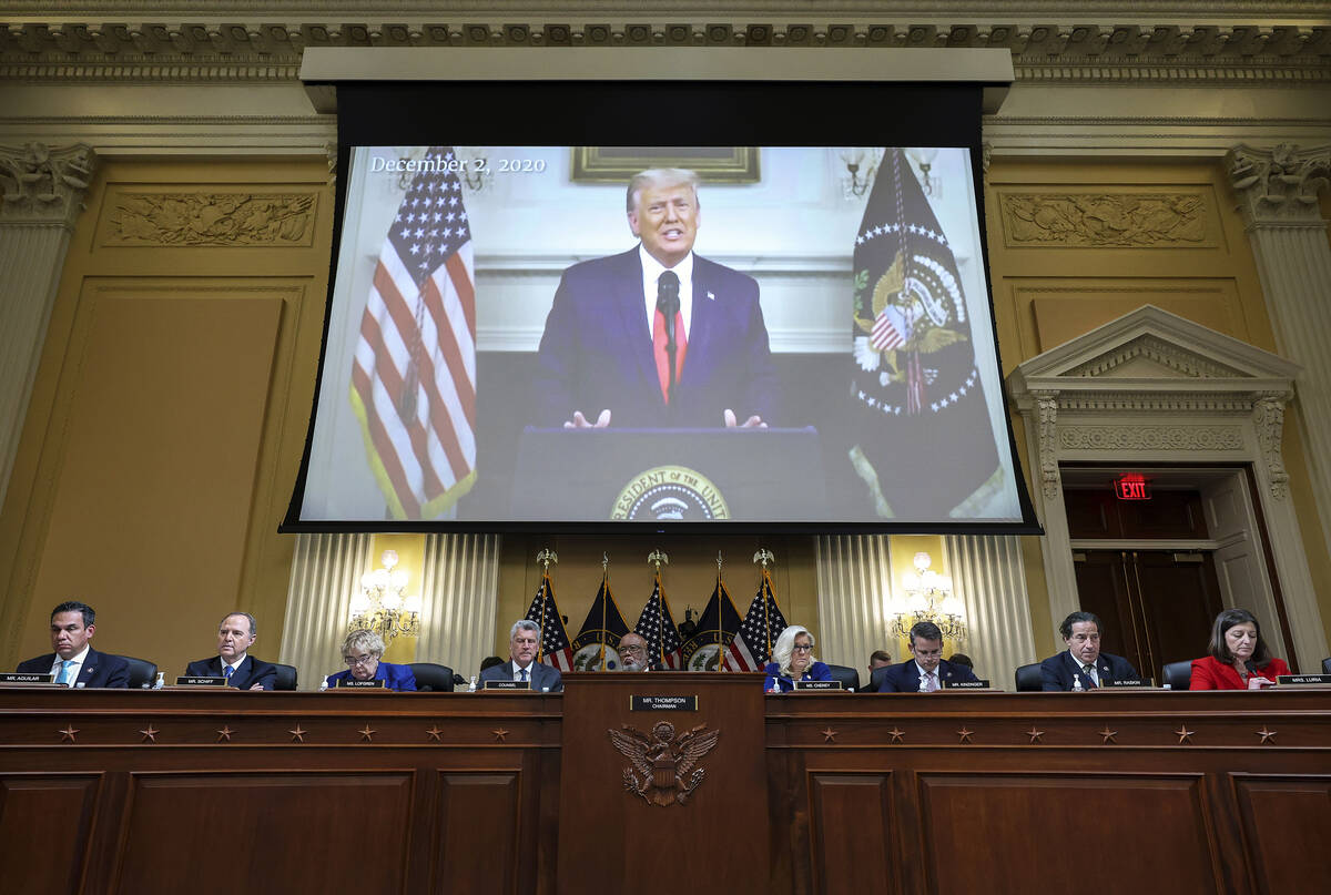 A video of then-President Donald Trump speaking is displayed as the House select committee inve ...