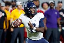 Connecticut's Zion Turner (11) throws the ball against North Carolina State during the first ha ...