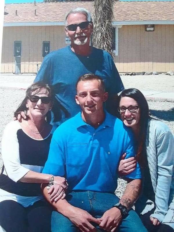 Isaiah Sharp, center, poses with his grandparents and mother in an undated photo. (Nicholas Snider)