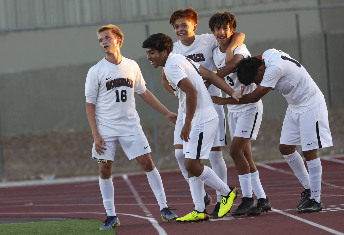 Desert Oasis' Lazzar Ramos (3) celebrates with teammates after scoring against Western during a ...