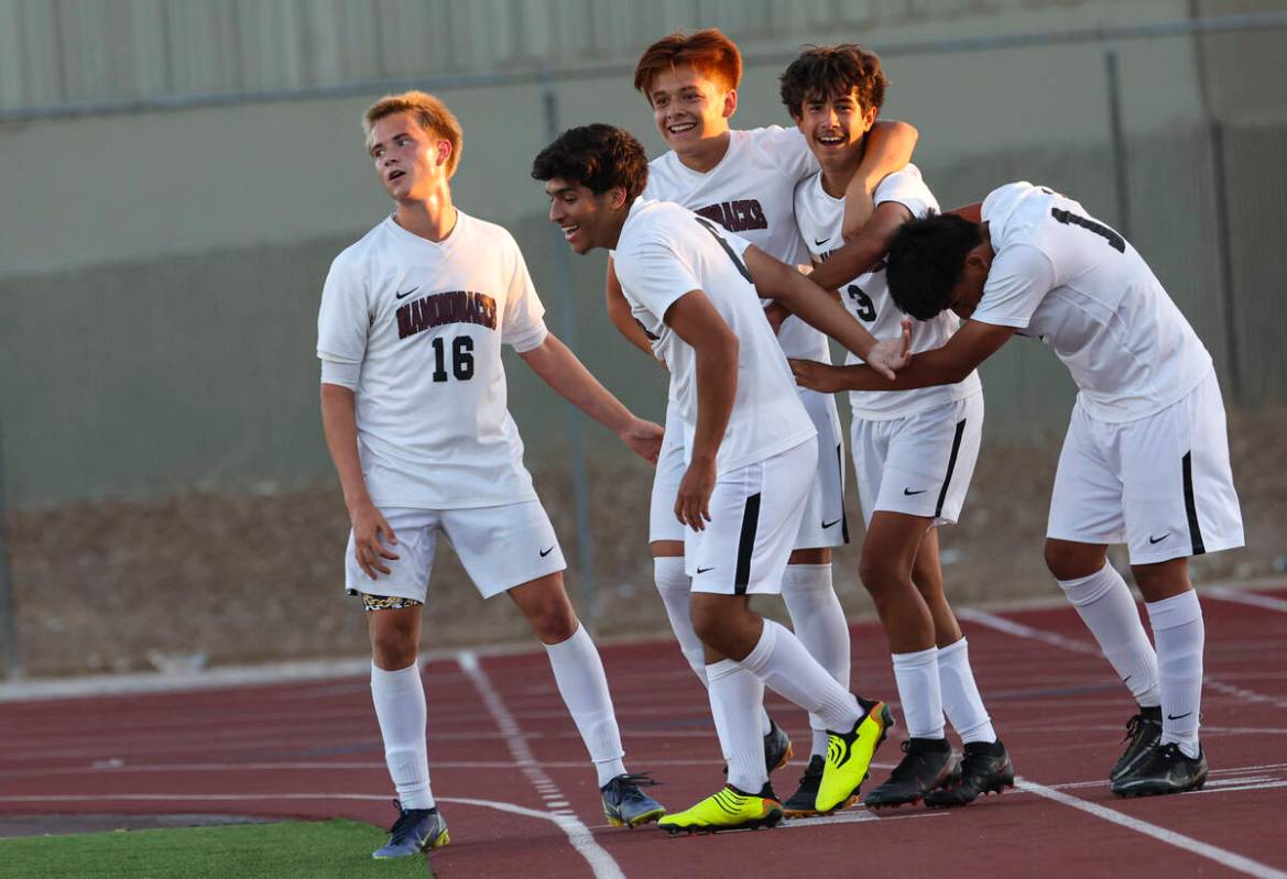 Desert Oasis' Lazzar Ramos (3) celebrates with teammates after scoring against Western during a ...