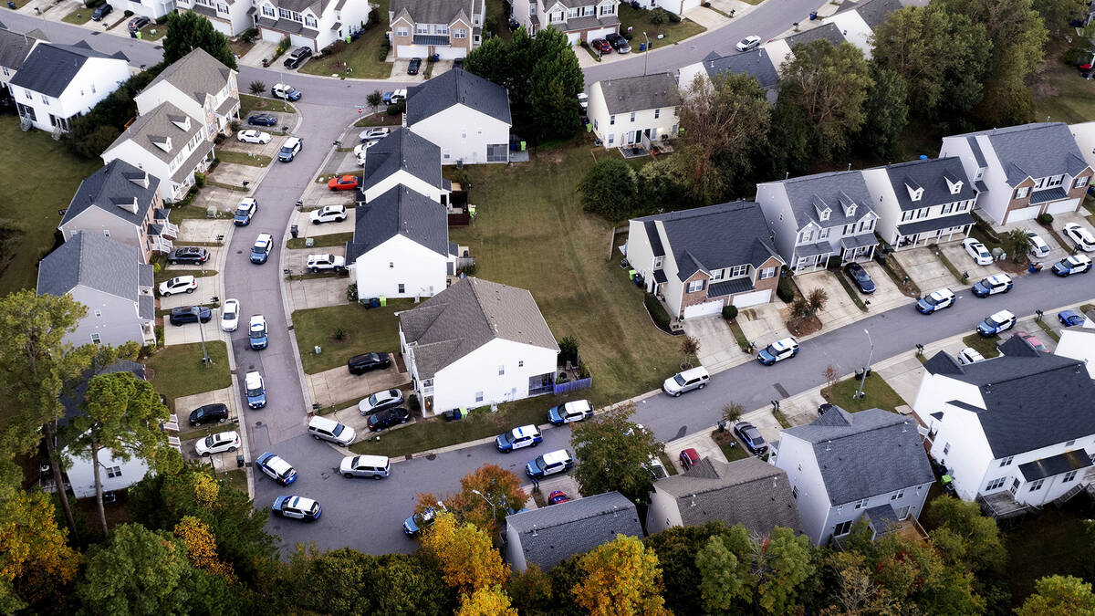 In this aerial image taken with a drone, Law enforcement work at the scene of a shooting in Ral ...