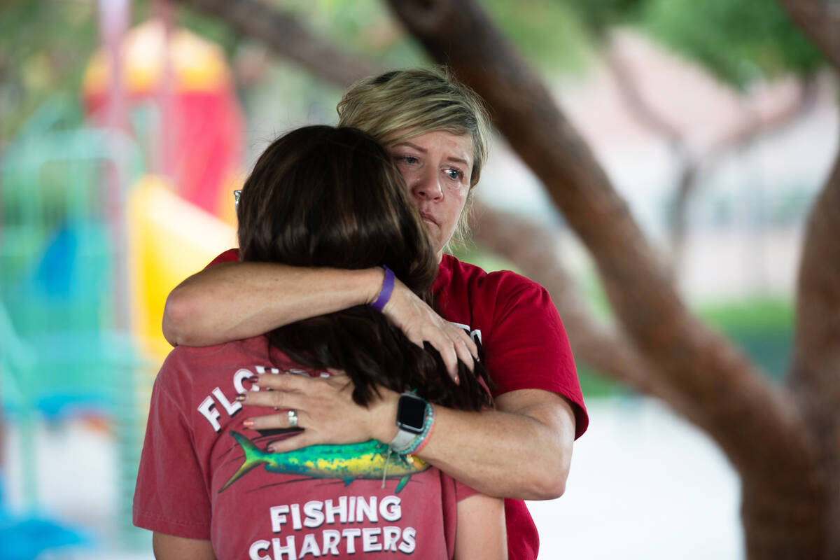 Jamie Gibo, facing, hugs her daughter Charlotte Gibo on Thursday, Oct. 13, 2022, in Las Vegas. ...