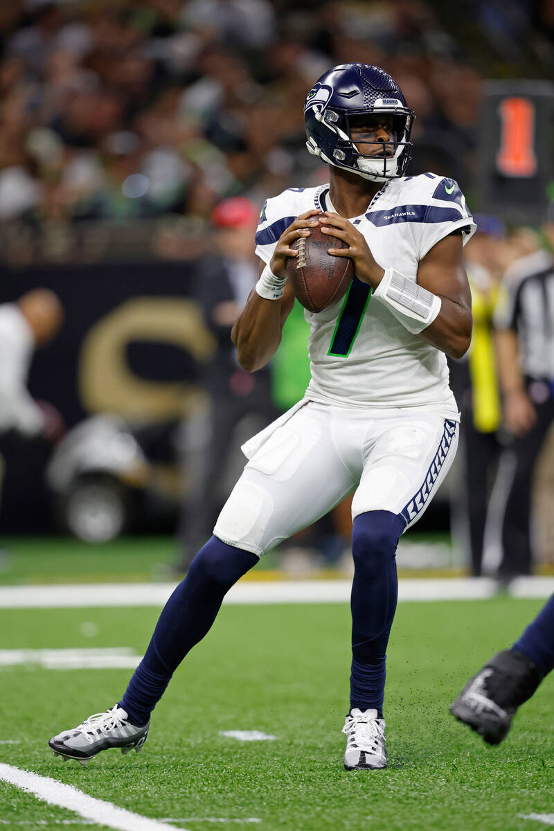 Seattle Seahawks quarterback Geno Smith (7) looks to pass during an NFL football game against t ...