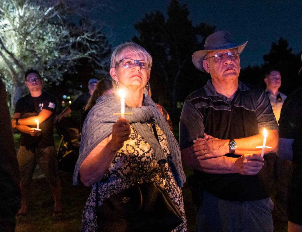 People gathered during a candlelight vigil for fallen Las Vegas police officer Truong Thai, on, ...