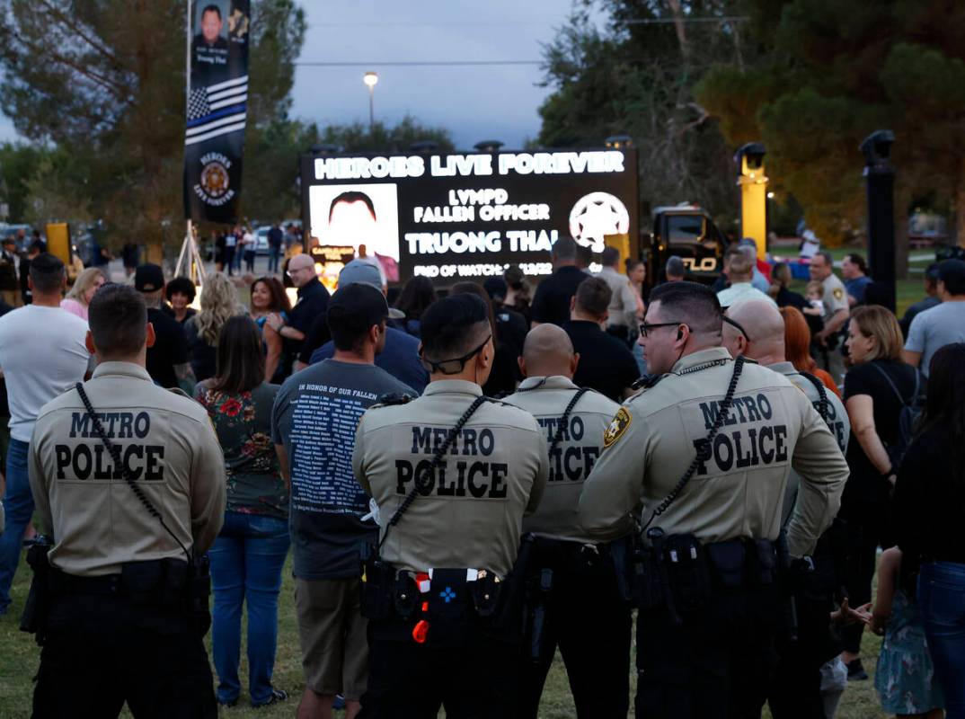 Las Vegas police officers gathered during a candlelight vigil for fallen Las Vegas officer Truo ...