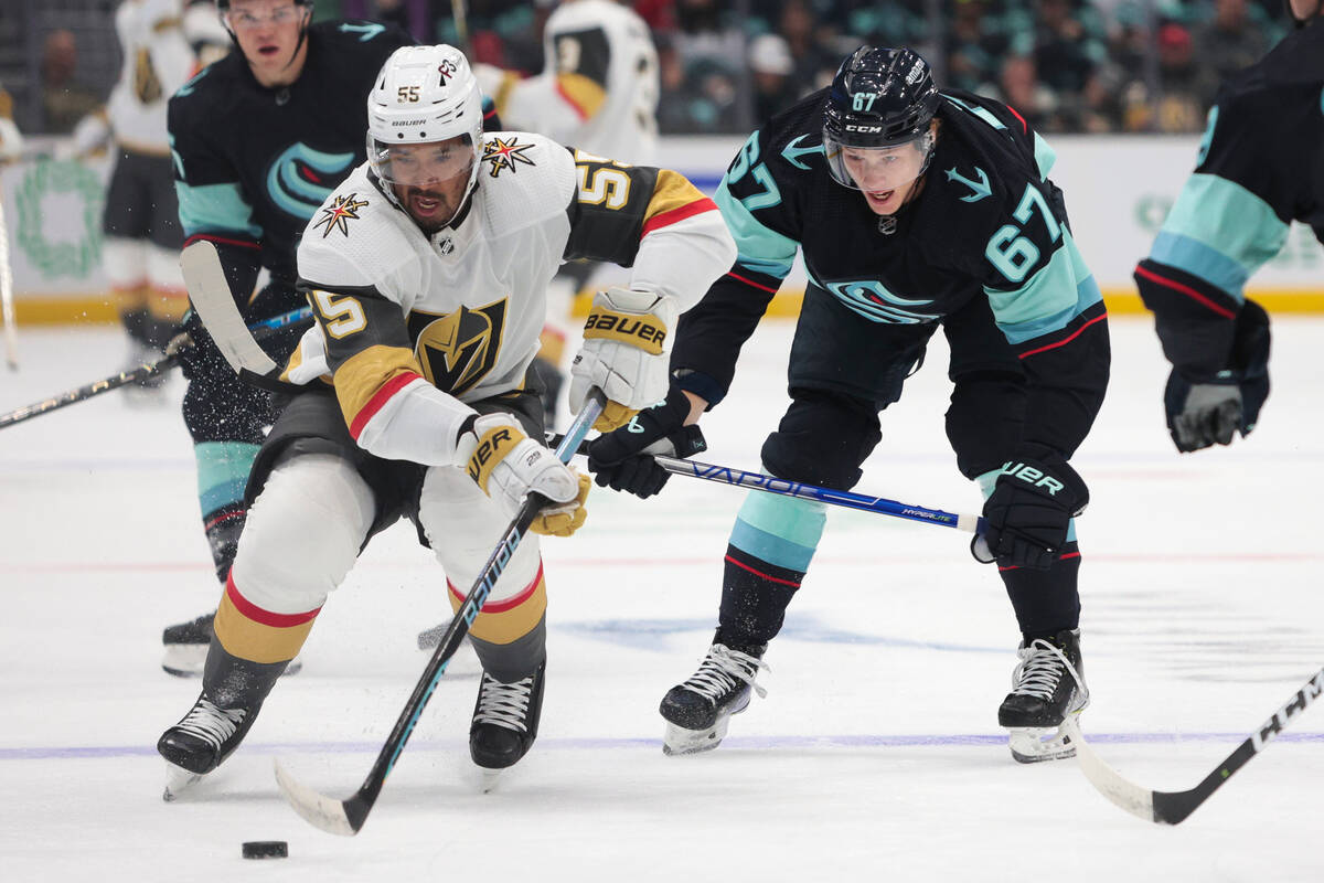 Vegas Golden Knights right wing Keegan Kolesar (55) carries the puck as Seattle Kraken center M ...