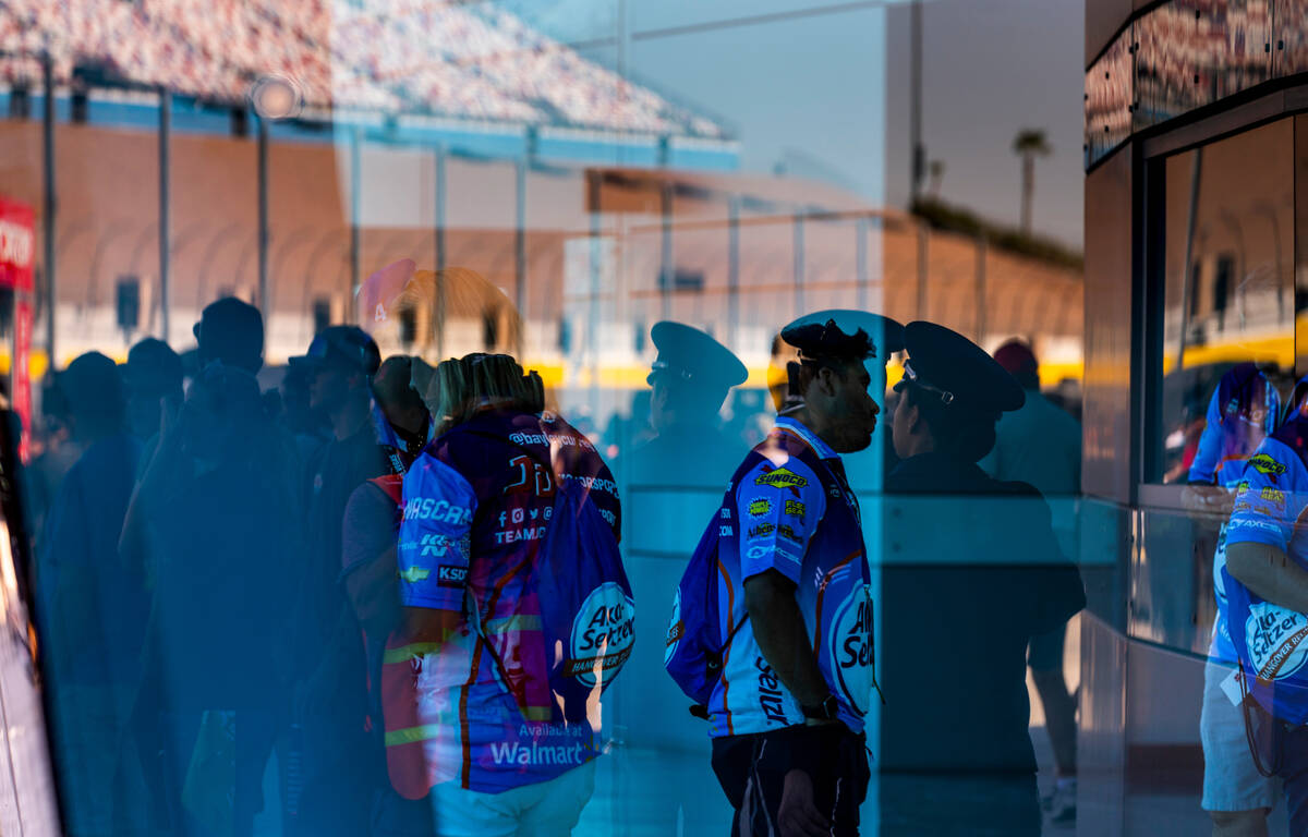 Fans are reflected in the glass during the Alsco Uniforms 302 NASCAR Xfinity Series Playoff Rac ...