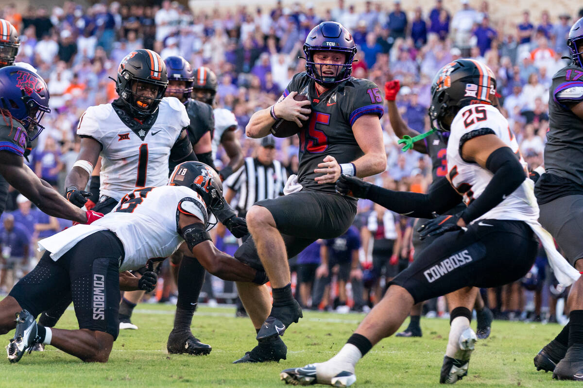 TCU quarterback Max Duggan (15) runs the ball during the second overtime period of an NCAA coll ...