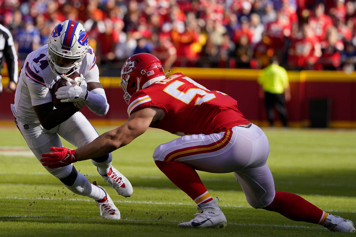 Buffalo Bills wide receiver Stefon Diggs (14) runs with the ball as Kansas City Chiefs lineback ...