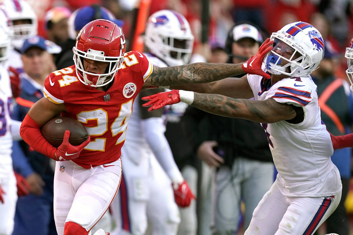 Kansas City Chiefs wide receiver Skyy Moore (24) runs with the ball as Buffalo Bills cornerback ...