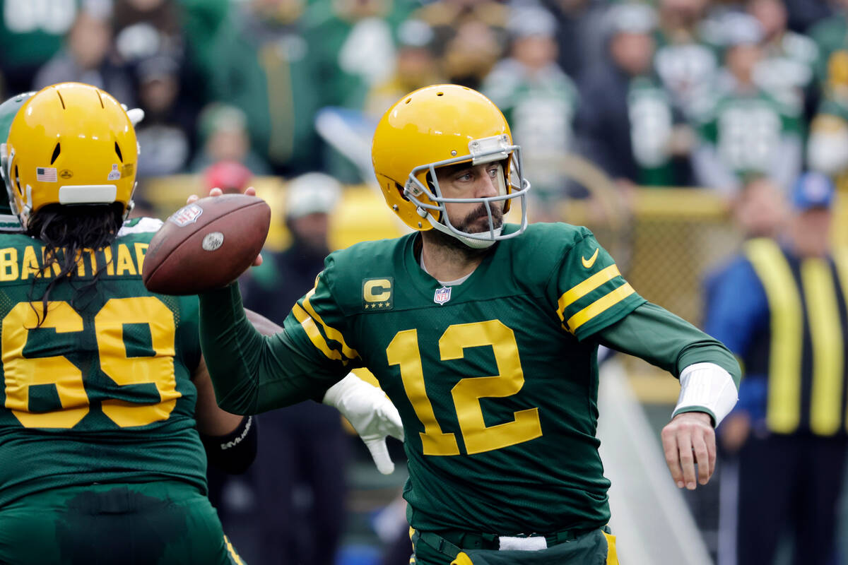 Green Bay Packers quarterback Aaron Rodgers throws during the first half of an NFL football gam ...