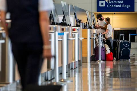 Passengers check their luggage in Terminal D at DFW International Airport in 2020. (Lynda M. Go ...