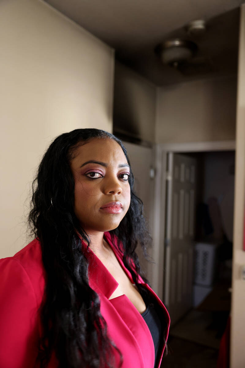 Cherise Coleman with a smoke alarm in her North Las Vegas home Friday, Oct. 21, 2022. Coleman c ...