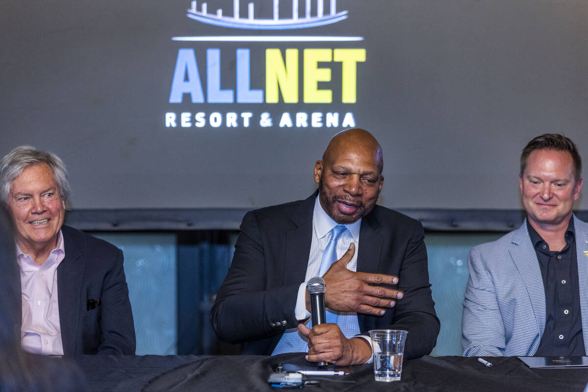 Ex-NBA player Jackie Robinson, center, holds a press conference to announce funding for his lon ...